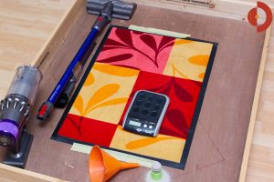 Dyson-V11-Absolute-Test-Testflaeche-Quarzsand-Schmutzmatte